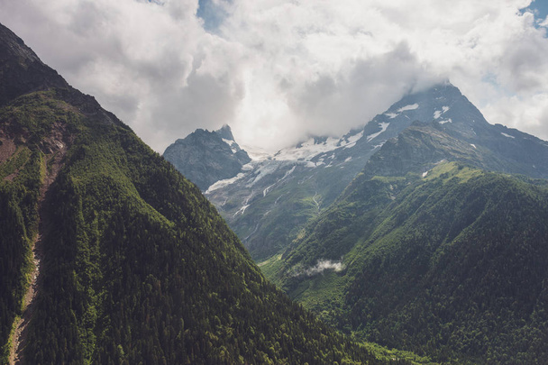 mountains with green grass and stormy sky - Zdjęcie, obraz