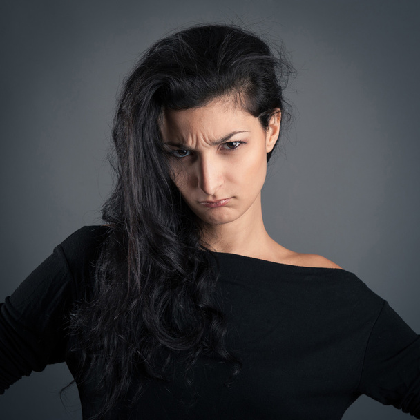 Woman close up portrait on dark background. Desperate expression - Fotografie, Obrázek