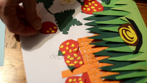 glue dots on paper strawberry. to craft paper garden with grass, snail, strawberry plant. tinker. - Footage, Video