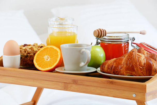 Breakfast in bed in hotel room. - Photo, Image