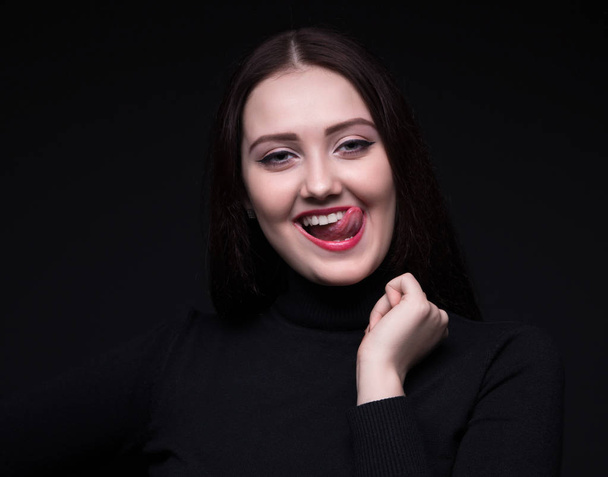 Portrait of smiling woman with tongue - Fotografie, Obrázek
