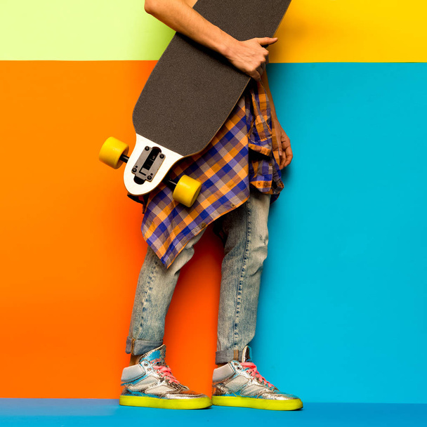 Skateboard Fashion Girl. Minimal design. Stylish clothes - Фото, изображение