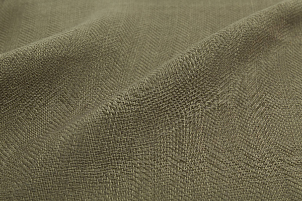 kaki achtergrond luxe doek of golvende plooien van grunge zijde satijn fluwelen textuur - Foto, afbeelding