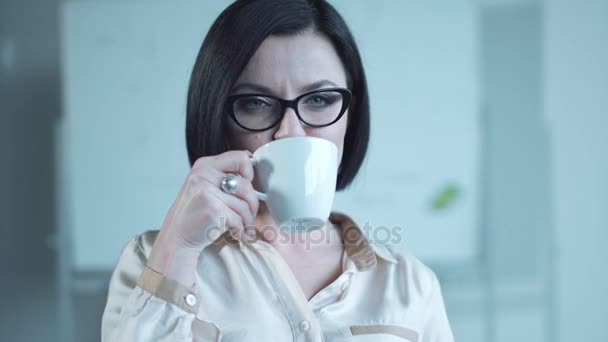 Woman drinking from cup - Footage, Video