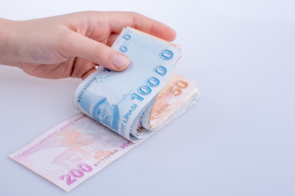Billetes turksh lira en mano
 - Foto, Imagen