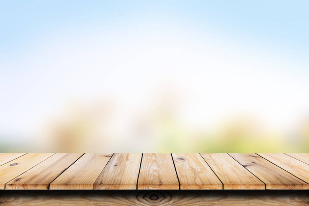 Empty wooden table with blur natural background. - Foto, imagen