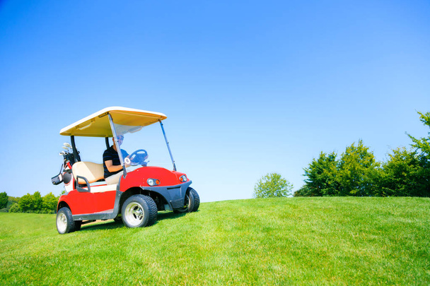 Man Driving A Golf Cart - Фото, зображення