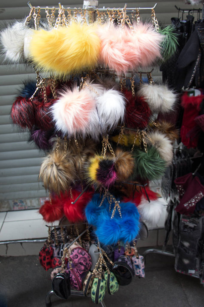 Set of different colours and shapes of pompoms in an bazaar - Foto, immagini