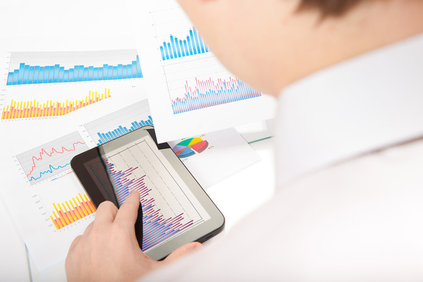 Businessman analyzing with tablet pc - Photo, Image