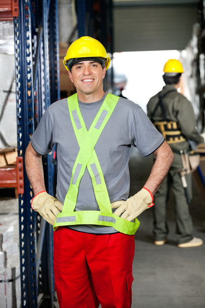 Mid Adult Foreman With Hands On Hips At Warehouse - Foto, Imagen