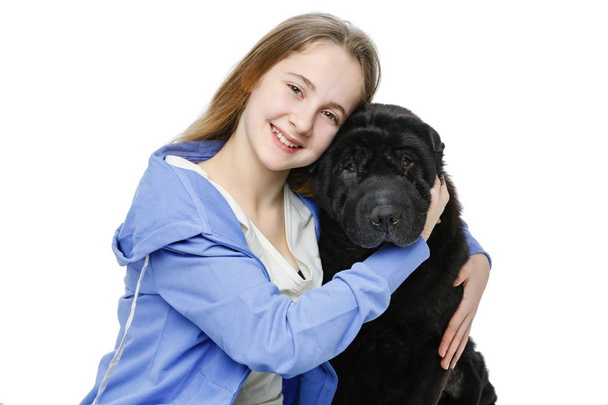 Дівчина підліткового віку з собакою
 - Фото, зображення