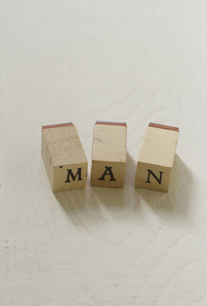 Letter blocks forming the word man  - Фото, изображение