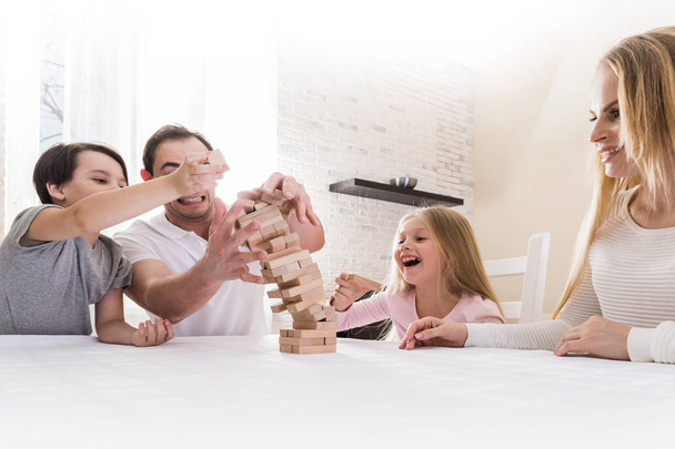 Family playing Jenga - Foto, Imagem