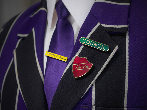 School boys blazer with three school badges - Photo, Image