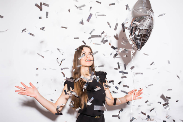 Beauty woman holding star balloon with fly confetti - Foto, immagini