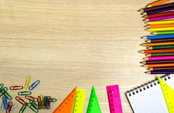 School supplies (pencil, pen, ruler, triangle) on blackboard bac - Photo, Image