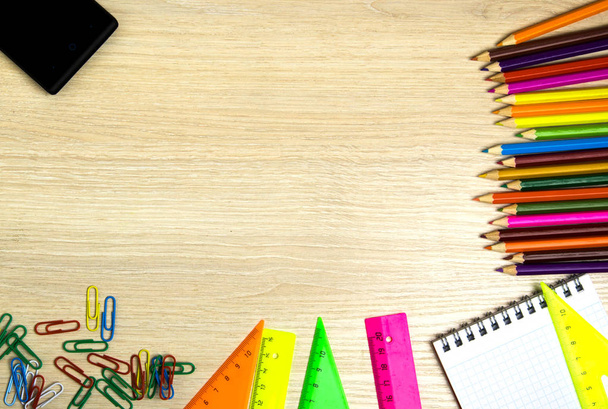 School supplies (pencil, pen, ruler, triangle) on blackboard bac - Фото, зображення