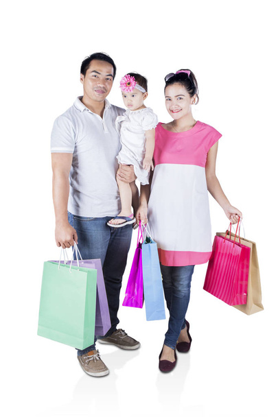 Smiling family hold shopping bag - Zdjęcie, obraz