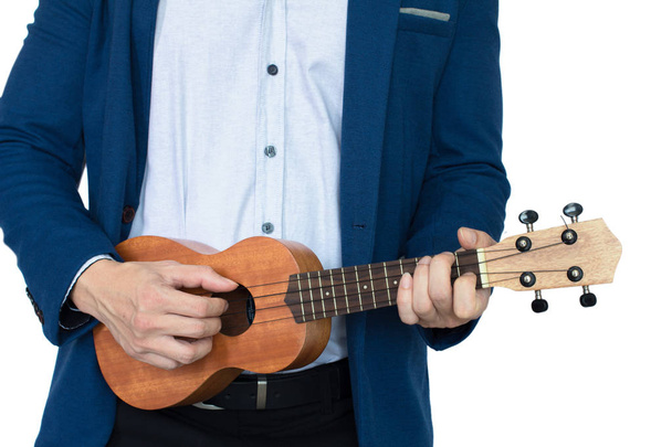 abiti da uomo e ukulele
 - Foto, immagini
