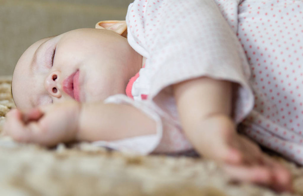 Portrait of a sleeping cute newborn baby - Photo, Image