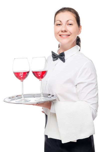 Vertical portrait of a waitress with alcoholic drinks on a tray  - Photo, Image