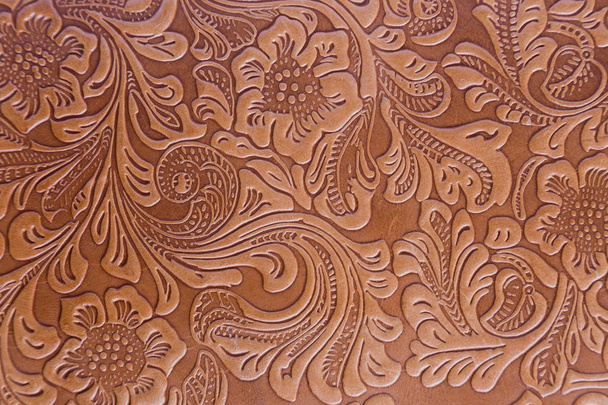 Impression florale gravée sur couverture de livre en cuir
 - Photo, image