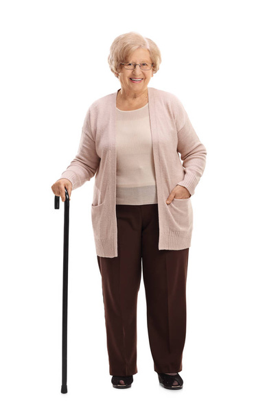 Elderly woman with a walking cane smiling - Φωτογραφία, εικόνα