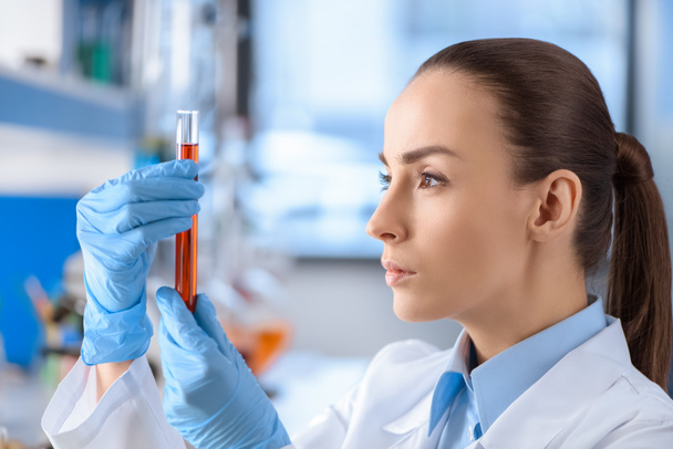 scientist with laboratory tube - Фото, изображение