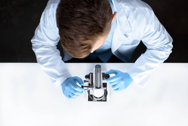 scientist working with microscope - Photo, image