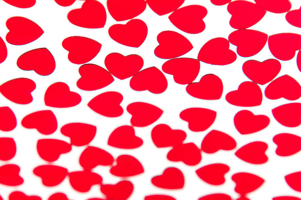 Valentines day pattern of red hearts confetti on white background.  - Foto, Imagem