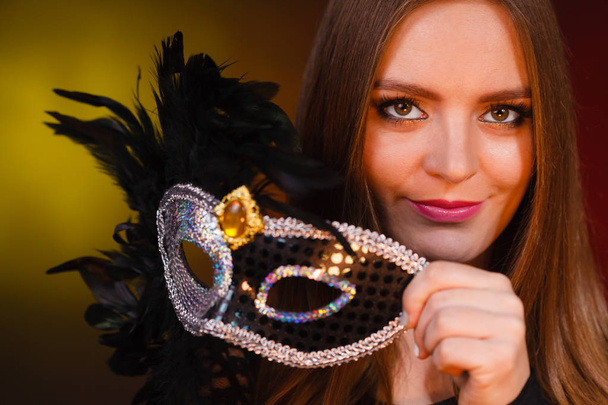 Sensual lady holding carnival mask. - Foto, immagini