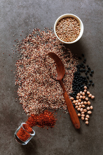 Composition of various kinds of legumes on black background - Photo, image