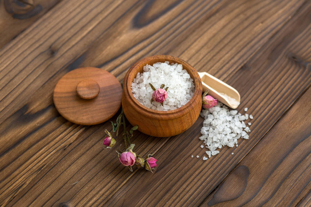Sea salt for spa and beauty on the wooden background - Photo, Image