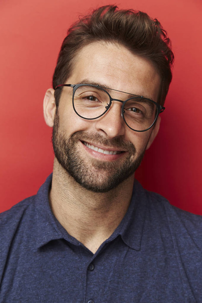 Smiling man in polo shirt - Фото, изображение