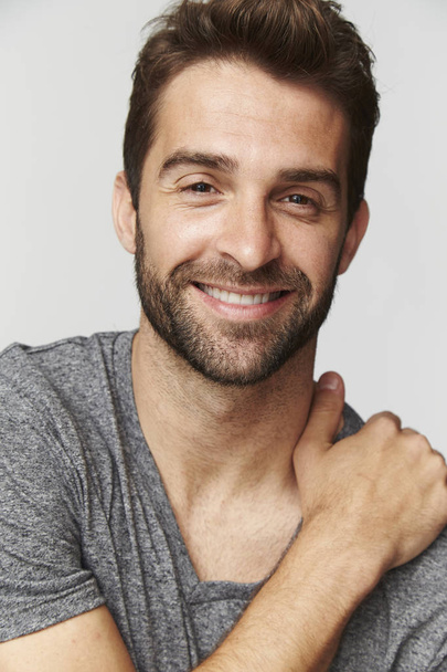 Smiling man in grey t-shirt - Фото, зображення