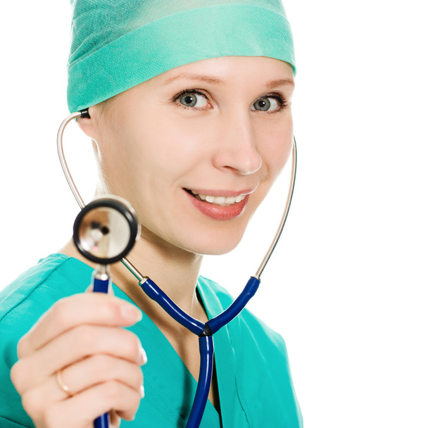 Beautiful woman doctor with stethoscope in hand. - Φωτογραφία, εικόνα