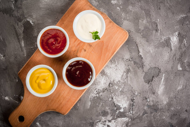 Classic set of sauces in white saucers - Photo, Image