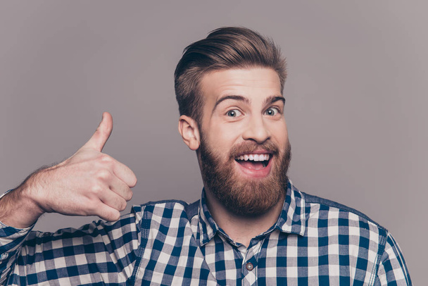 Young happy stylish bearded guy showing thumb up - Φωτογραφία, εικόνα