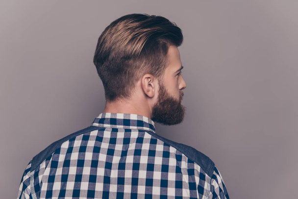Back view of stylish  young bearded man with modern hairstyle - Fotó, kép