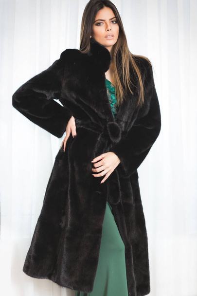 Beautiful woman in luxury fur coat indoor - Foto, immagini