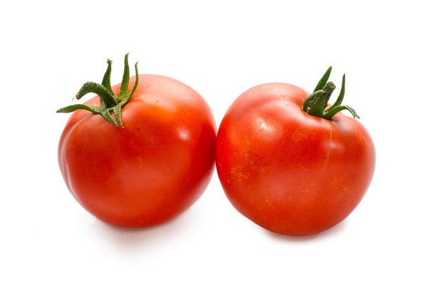 Red fresh tomatoes closeup on white background - Фото, изображение
