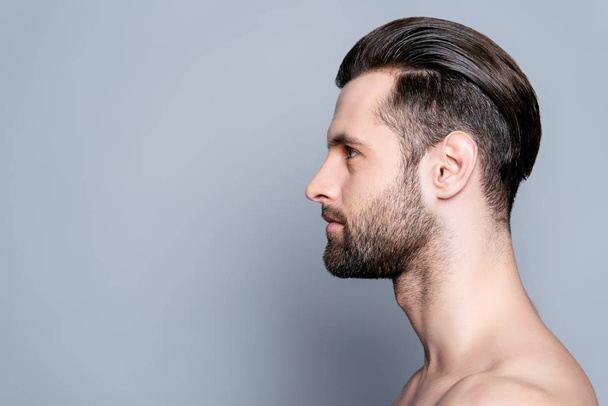 Side view of handsome young bearded man after bath - 写真・画像