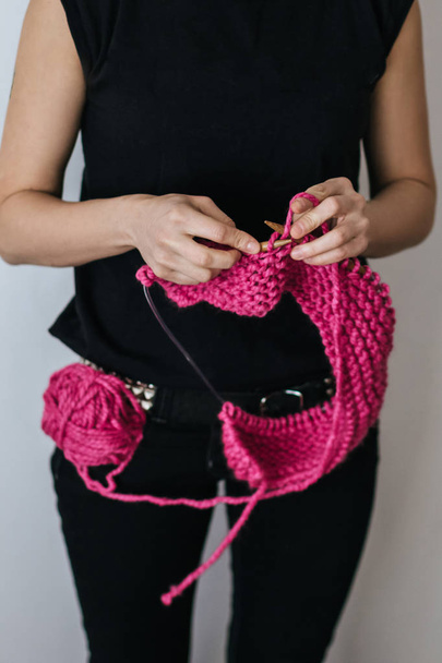 Punk girl knitting with pink wool - Photo, Image