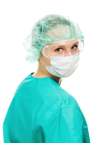 Surgeon woman in protective glasses and mask - 写真・画像