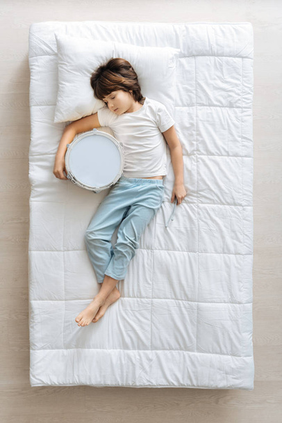 boy napping after playing drum  - Photo, image