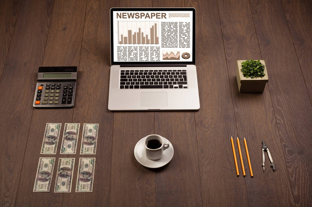 Business laptop with stock market report on wooden desk - Foto, Bild