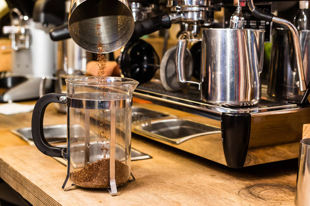 Barista making non traditional coffee in french press - Foto, afbeelding