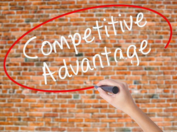 Woman Hand Writing Competitive Advantage with black marker on vi - Photo, Image