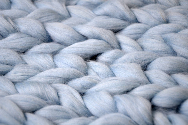 メリノ ・ ウールの手作りニット大きな毛布、超分厚い糸、トレンディなコンセプト。ニット ブランケット、メリノ羊毛背景のクローズ アップ - 写真・画像