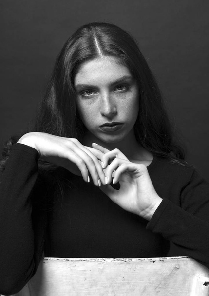 Black and white portrait of a sad girl dressed in black blouse. - Φωτογραφία, εικόνα